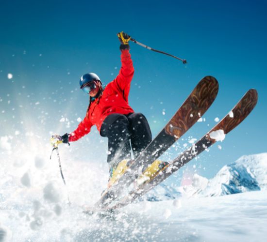 photo of a skier spraying powder snow